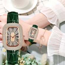 Detail of elegant emerald leather strap and diamond-encrusted bezel on women's vintage watch