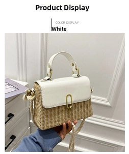 Detail of beige straw handbag featuring white leather flap and golden U-shaped lock closure