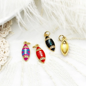 Detailed view of colorful American football pendants with zircons on white feathers