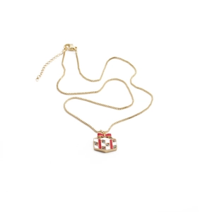 Gold plated box chain necklace featuring a white gift box pendant with red enamel bow