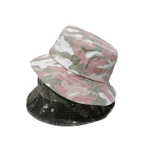 Vintage washed camouflage bucket hats for hiking in pink and green colors on white background