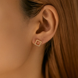 Minimalist square zircon earrings in 18K gold finish shown on model ear for daily chic style