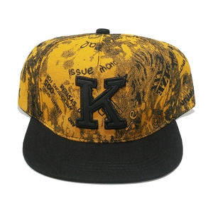 Graffiti print hip-hop baseball cap in yellow with black flat brim and 3D embroidered K