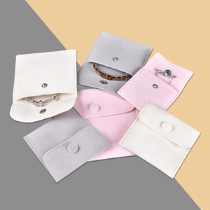 Velvet jewelry pouches with metal snap buttons for rings and necklaces in three colors