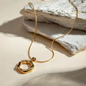 18k gold plated stainless steel necklace with irregular hammered round pendant on snake chain