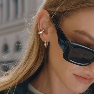 Elegant stainless steel silver zircon ear cuff and pearl hoop earrings on model