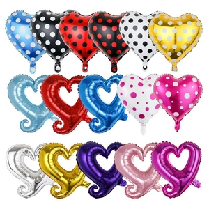 Detailed display of colorful heart foil balloons with polka dots and cutout designs
