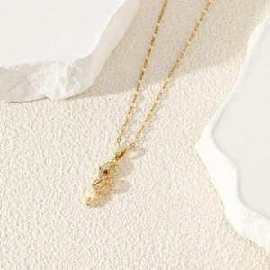 Hiphop gold snake pendant necklace for women with white zircons and red eyes