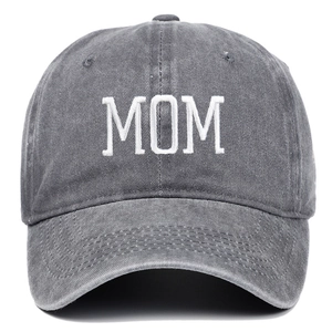 Detail of MOM embroidery on dark gray washed cotton baseball cap with high texture