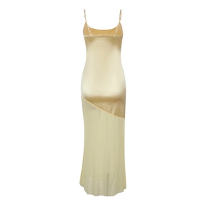 Detail of elegant champagne satin dress with sheer mesh splicing and slim straps