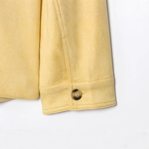 Chic yellow suede jacket featuring a lapel collar and stylish tortoiseshell cuff buttons