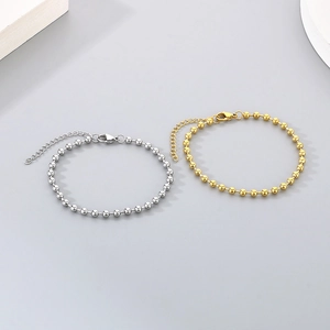 Detail of 18K gold and silver plated twist chain bracelets with lobster clasp and extender
