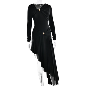 Detail of black V-neck dress featuring elegant gold buttons and stylish ruched waistline