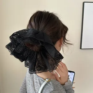 Elegant large black double-layer lace scrunchie with floral embroidery for bun hairstyles