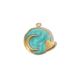 Macro detail of golden Tree of Life pendant with blue resin, moon and heart charms