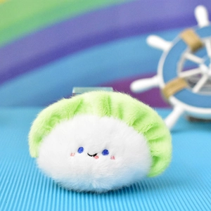 Detailed macro view of a cute plush dumpling charm with an adorable embroidered smiley face