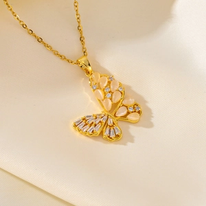 Golden butterfly necklace with cat-eye stone and zircons on champagne silk