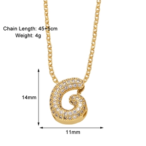 Macro view of gold letter G necklace with zircon inlay and product size specifications