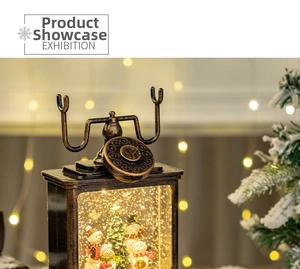 Close-up of vintage bronze telephone snow globe with snowman and Christmas tree scene