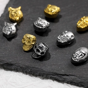 Detailed relief of stainless steel skull and wolf head beads for DIY jewelry making