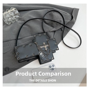 Detail of black gothic cross-shaped handbag with silver metal studs and multi-layer chains