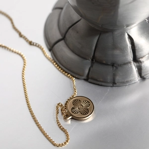 Long stainless steel gold necklace with a round four-leaf clover pendant for women