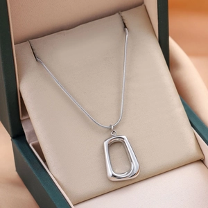 Minimalist silver geometric pendant necklace displayed in a premium jewelry gift box