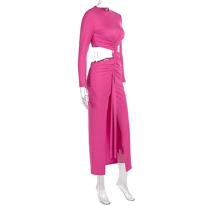 Detail view of the side cutout and waist ruching on this hot pink long sleeve dress
