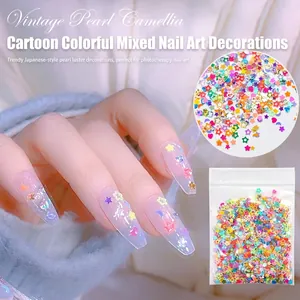 Macro view of colorful geometric sequins applied on long transparent manicured nails