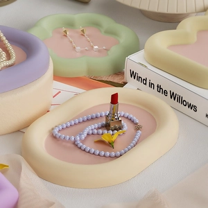 Cloud-shaped storage trays in matte pastel colors for jewelry and lipstick storage