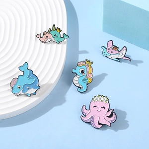 Set of 5 colorful enamel ocean animal pins including octopus and seahorse on blue base
