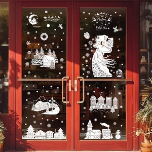 Stickers de Noël blancs avec Père Noël et village enneigé sur une porte rouge