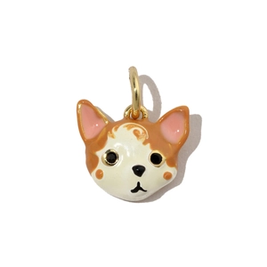 Detailed view of handmade enamel dog charm with gold-plated metal loop for jewelry