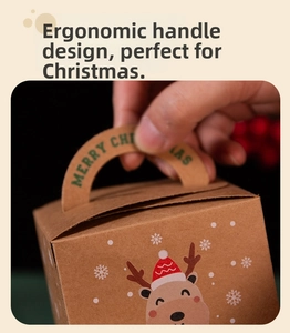 Detail view of brown kraft paper Christmas gift box with reindeer print and handle