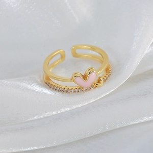 Detail of a pink heart double-layer open ring with sparkling white cubic zirconia stones