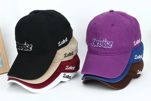 Classic cotton baseball caps with 'Devise' embroidery in various colors stack