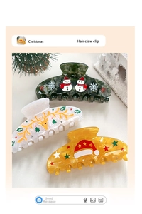 Detailansicht der Weihnachts-Haarklammern mit Schneemann- und Rentier-Motiven