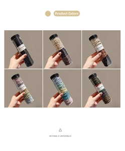 Detailed view of six colorful elastic hair band sets in transparent storage tubes