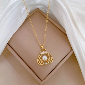 Luxurious gold titanium steel necklace with fan-shaped pearl and zircon pendant