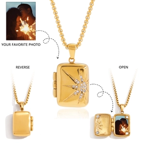 Detail of vintage gold tarot locket necklace showing front, reverse and open photo view
