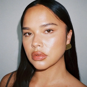 Close-up of 18K gold-plated stainless steel square earrings with wave texture on model