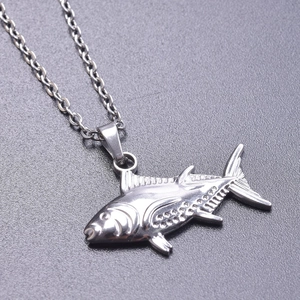 Macro shot of silver fish pendant with detailed scale textures and stainless steel chain