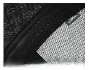 Macro detail of breathable black sweatband with reinforced double stitching on sports cap