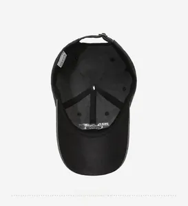 Detail view of 100% cotton inner lining and adjustable metal buckle on black baseball cap