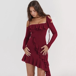 Detail of burgundy off-shoulder dress with elegant ruffles and asymmetrical hemline