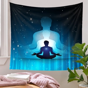 Detailed view of a meditation tapestry with galaxy silhouette in a cozy room setting