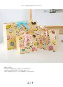 Three assorted sizes of cartoon animal gift bags with colorful silk bow handles