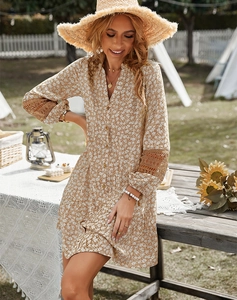 Detail of brown floral dress featuring lace拼接 on long sleeves and V-neckline buttons