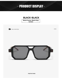 Detail view of square black sunglasses with double bridge and wood texture temples