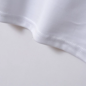 Close-up of white breathable mesh knit fabric and durable double-stitch hem on polo shirt